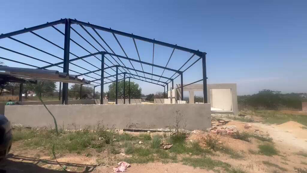 Steel roof trusses under construction