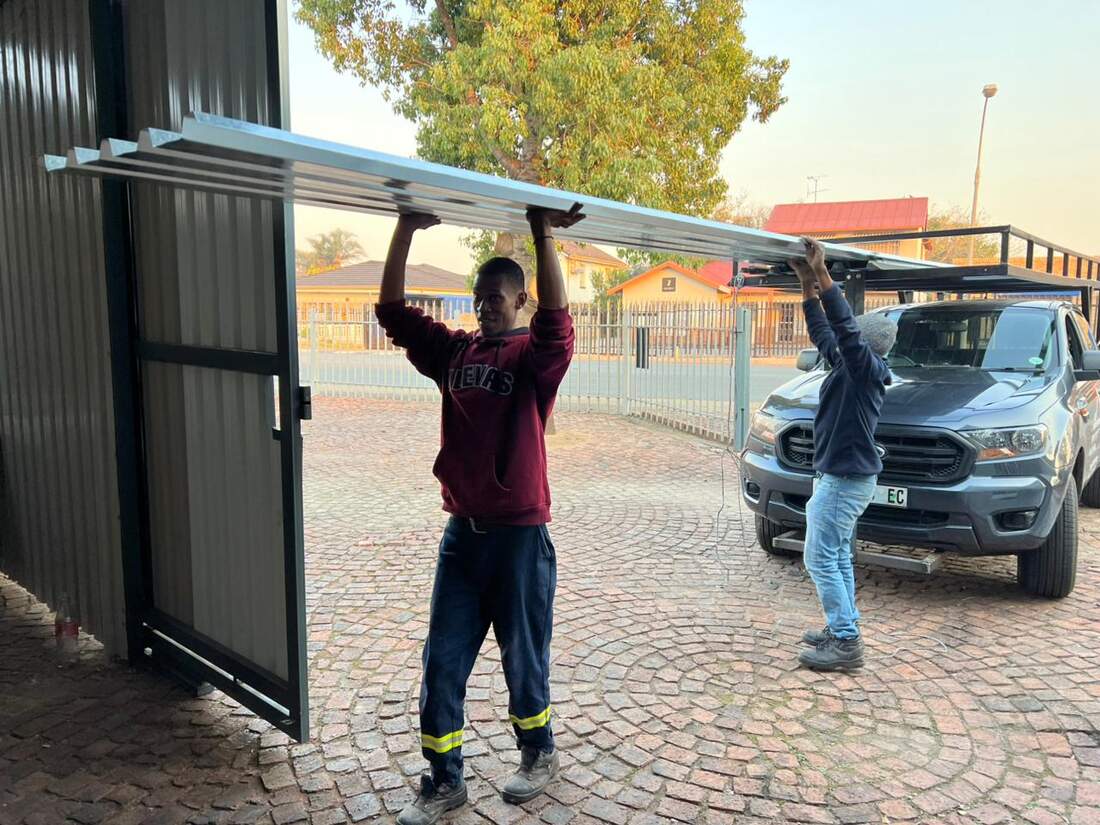 Team loading roofing materials